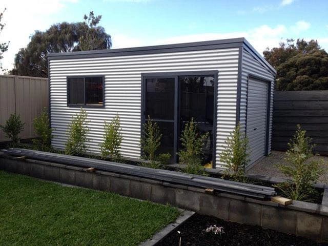 Modern prefabricated shed with white corrugated metal
